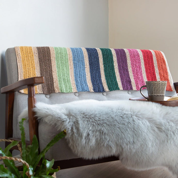Added Some Brightness To The Grey Sofa With Wool Couture's Rainbow Crochet Blanket Kit